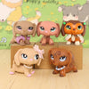 A set of five adorable dachshund bobblehead figurines in various shades of brown and tan.