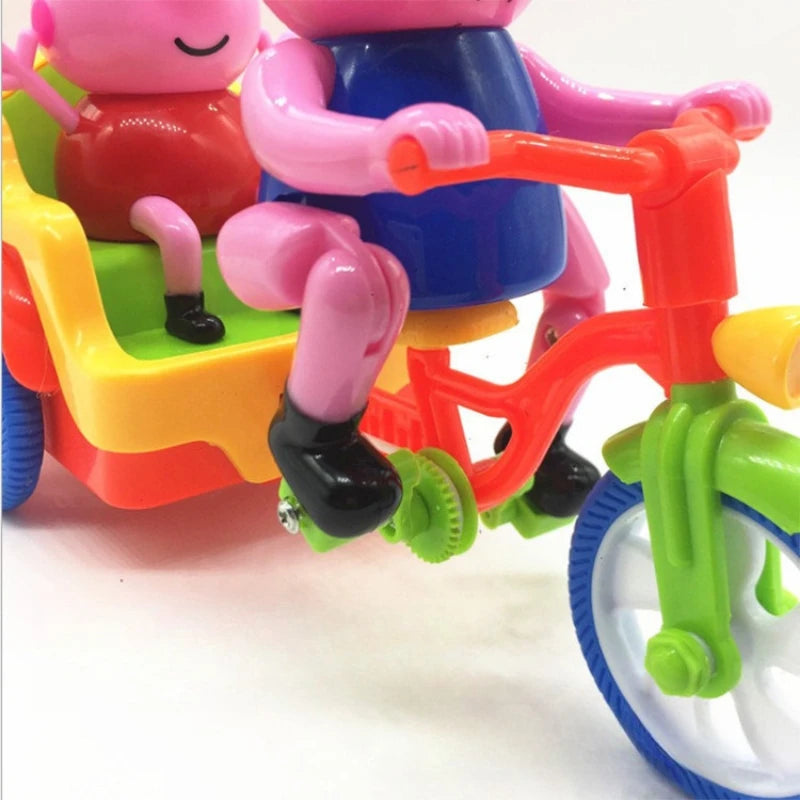 A pink and red ride-on toy car featuring pig figures, designed for children.