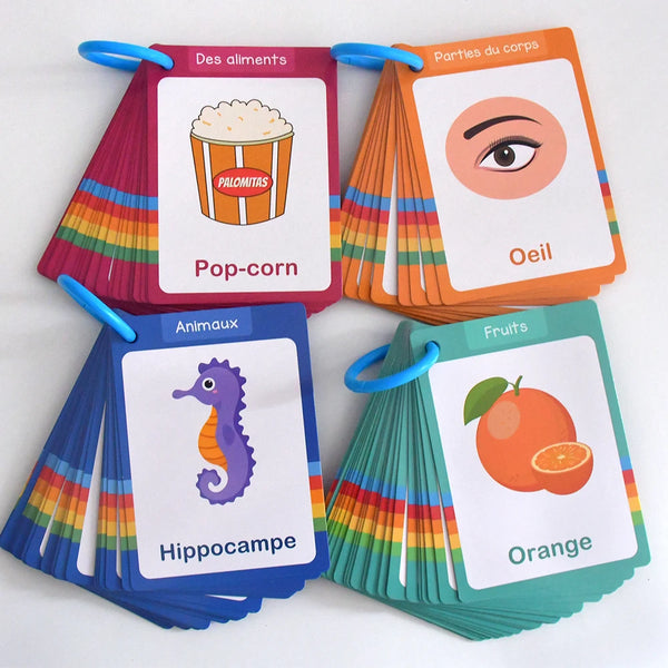 A set of colorful French vocabulary learning cards featuring images of popcorn, an eye, and a hippopotamus.