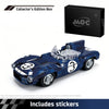 A blue die-cast model car of a race car is shown next to its collector's edition box and stickers.