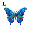 A vibrant blue and green butterfly jigsaw puzzle featuring irregular animal-shaped pieces.