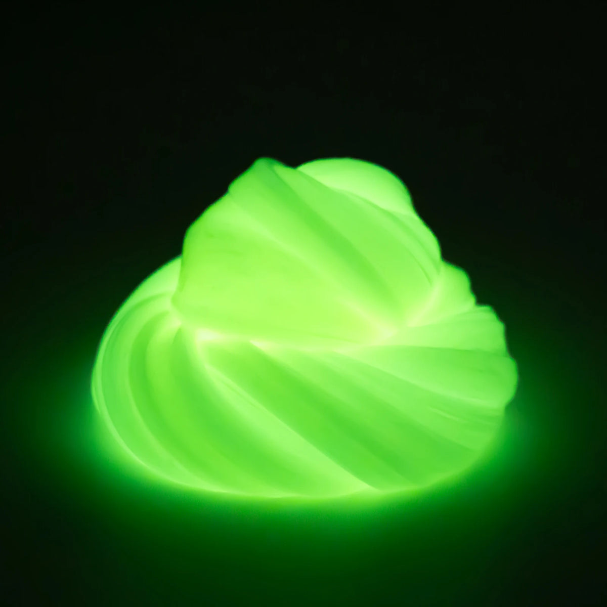 A glowing, translucent green crystal slime shaped like a swirling sphere against a dark background.