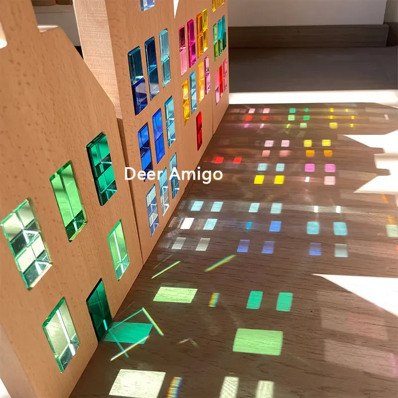 A wooden structure displaying colorful acrylic building blocks arranged in vertical rows and a sloping display.