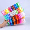 A clear plastic bag filled with various colored air-dry modeling clay and tools for creative kids