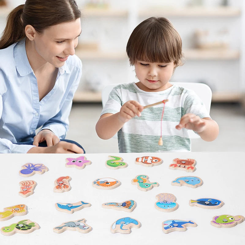 A collection of wooden magnetic fishing game pieces for children, including fish and other shapes.