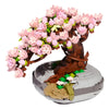 A building block set depicting a tree covered in pink and white flowers.