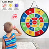 A child is playing an interactive sticky ball dart game on a circular target board with colored scoring zones.