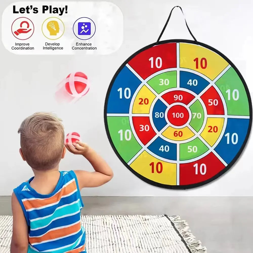 A child is playing an interactive sticky ball dart game on a circular target board with colored scoring zones.