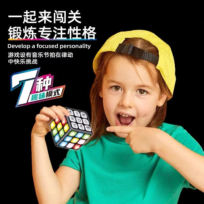 A young girl holds a musical brain teaser cube with flashing lights and a yellow headband.