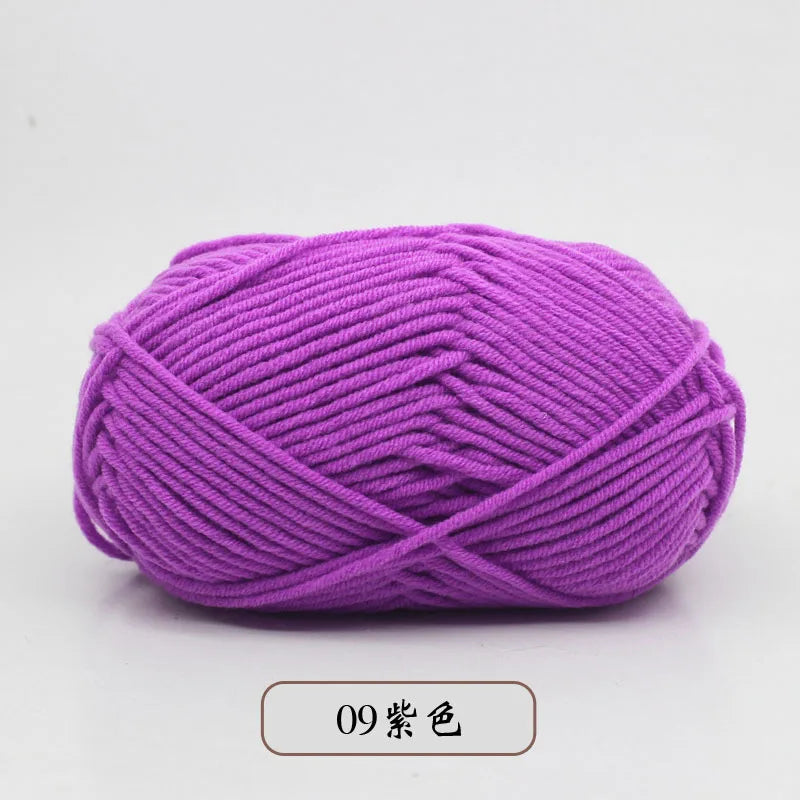 Purple pre-dyed milk cotton yarn in a ball for knitting and crochet
