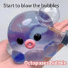 A purple octopus bubble squishy toy is held in a hand.