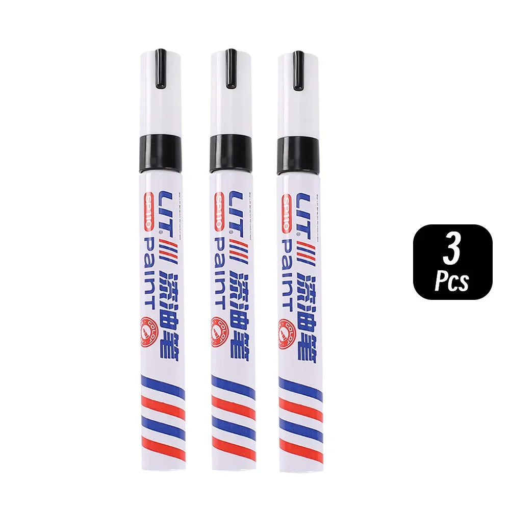 Three permanent paint markers in white and blue packaging are shown side by side.