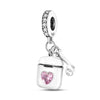 A silver heart charm bead with pink zircon stones and a bail, suspended from a chain.
