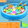 A blue inflatable pool filled with various plastic fish and fishing rods for a kids magnetic fishing game