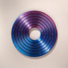 A circular ring made of iridescent blue and purple plastic, featuring concentric ridges.