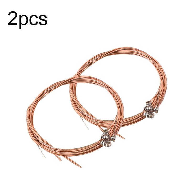 Two sets of rust-resistant acoustic guitar strings with a string changer tool.