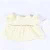 A yellow three-piece doll outfit set for a baby doll.