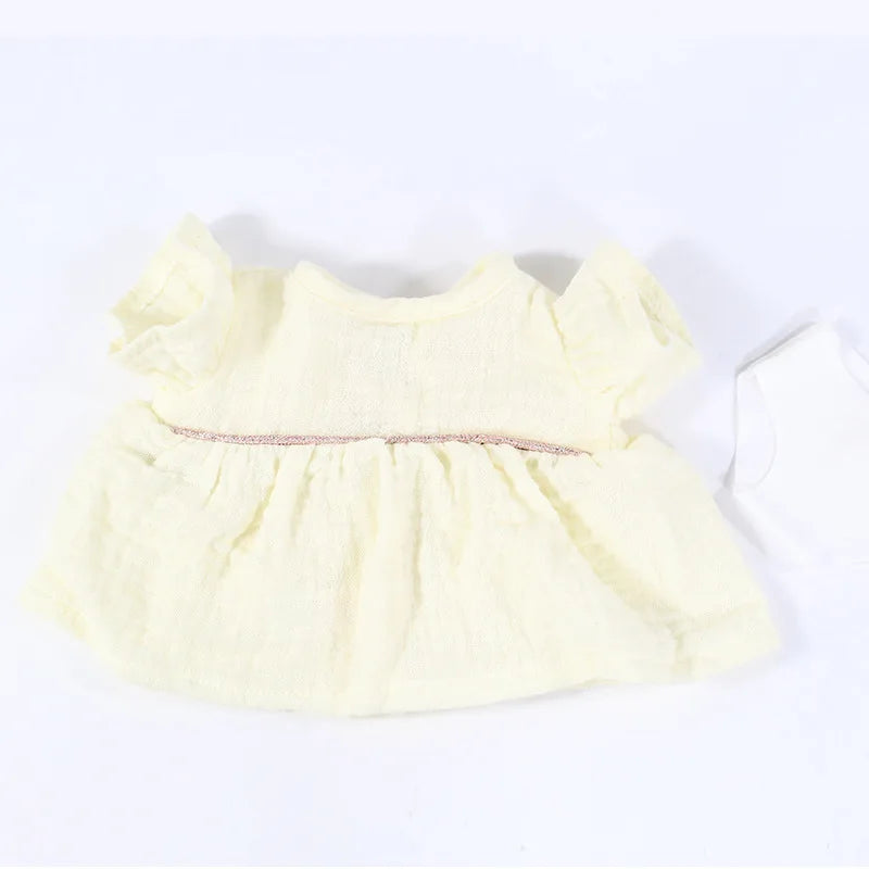 A yellow three-piece doll outfit set for a baby doll.