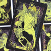 A tarot card illustration featuring a winged figure with a skull and skeletal elements, titled Judgment.
