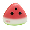 A squishy butter stick fidget toy shaped like a watermelon, featuring red and white colors with black spots.