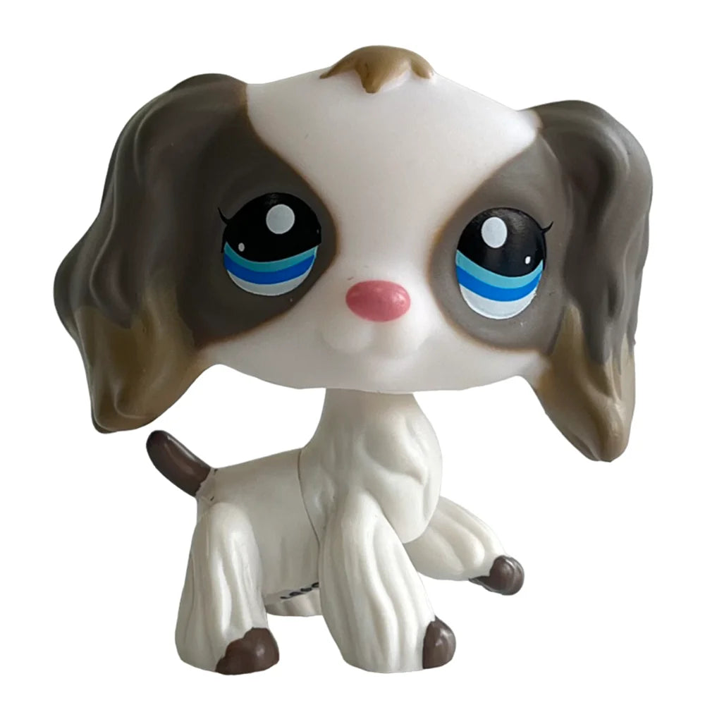 Sammler-Kittenfigur mit braunen und weißen Abzeichen, großen Augen und hängigen Ohren.
