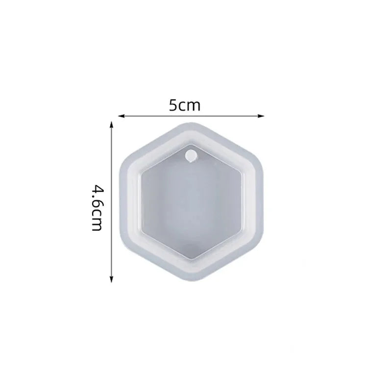 A white heart-shaped silicone mold for resin jewelry making, shown with dimensions of 5cm by 4.6cm.