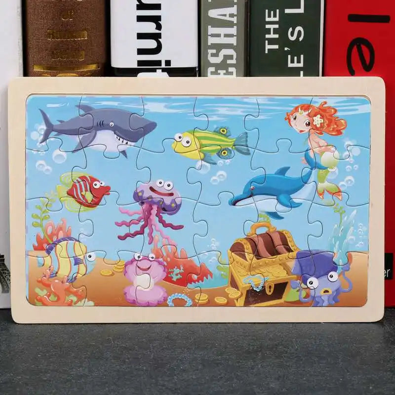 A 24-piece wooden jigsaw puzzle featuring colorful sea animals like a shark, fish, and sea creatures.