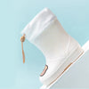 A white kids' waterproof bear rain boot with a slip-on closure shown against a light blue background.