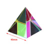 A geometric prism made of colored acrylic panels, displaying various iridescent and solid colors.