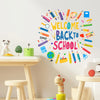 A colorful wall sticker set featuring various crayons, pencils, and markers spelling out Welcome Back to School on a light gr