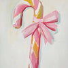 A painting of a striped pink and yellow candy cane with a pink bow against a light background.