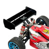 A red and black hard tail wing upgrade for an RC car, featuring a tire and mounting hardware.