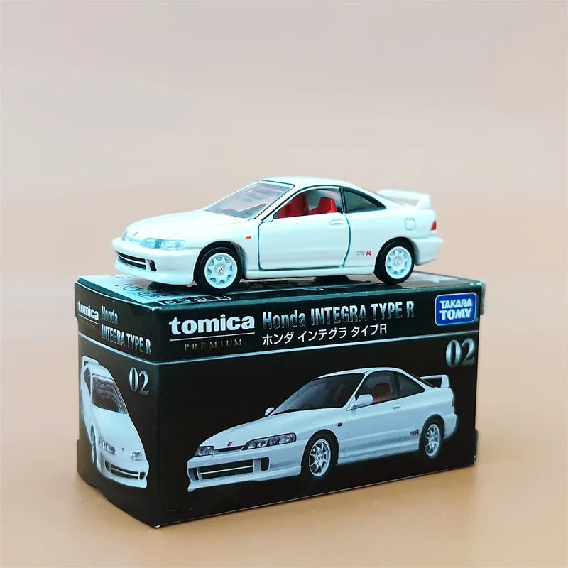 A white Honda Integra Type R die-cast model car displayed in its original packaging.