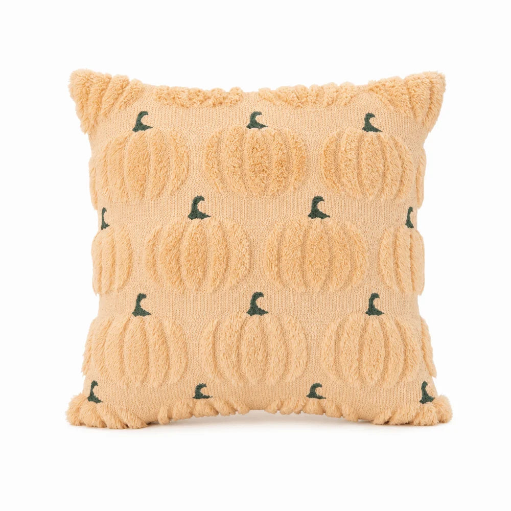 A square pillow cover made of tan sherpa fabric decorated with small green ghost pumpkin patterns.