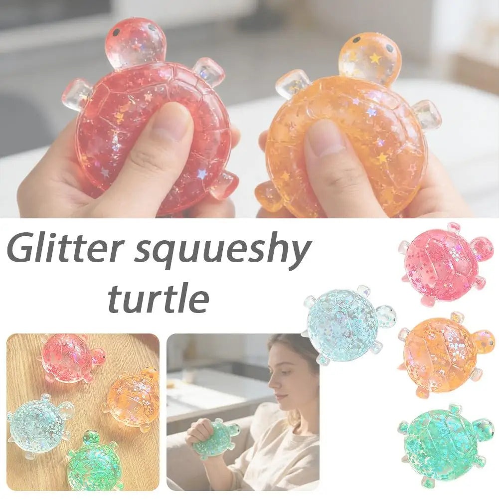 Hands hold a glitter squishy turtle toy in pink and orange colors.