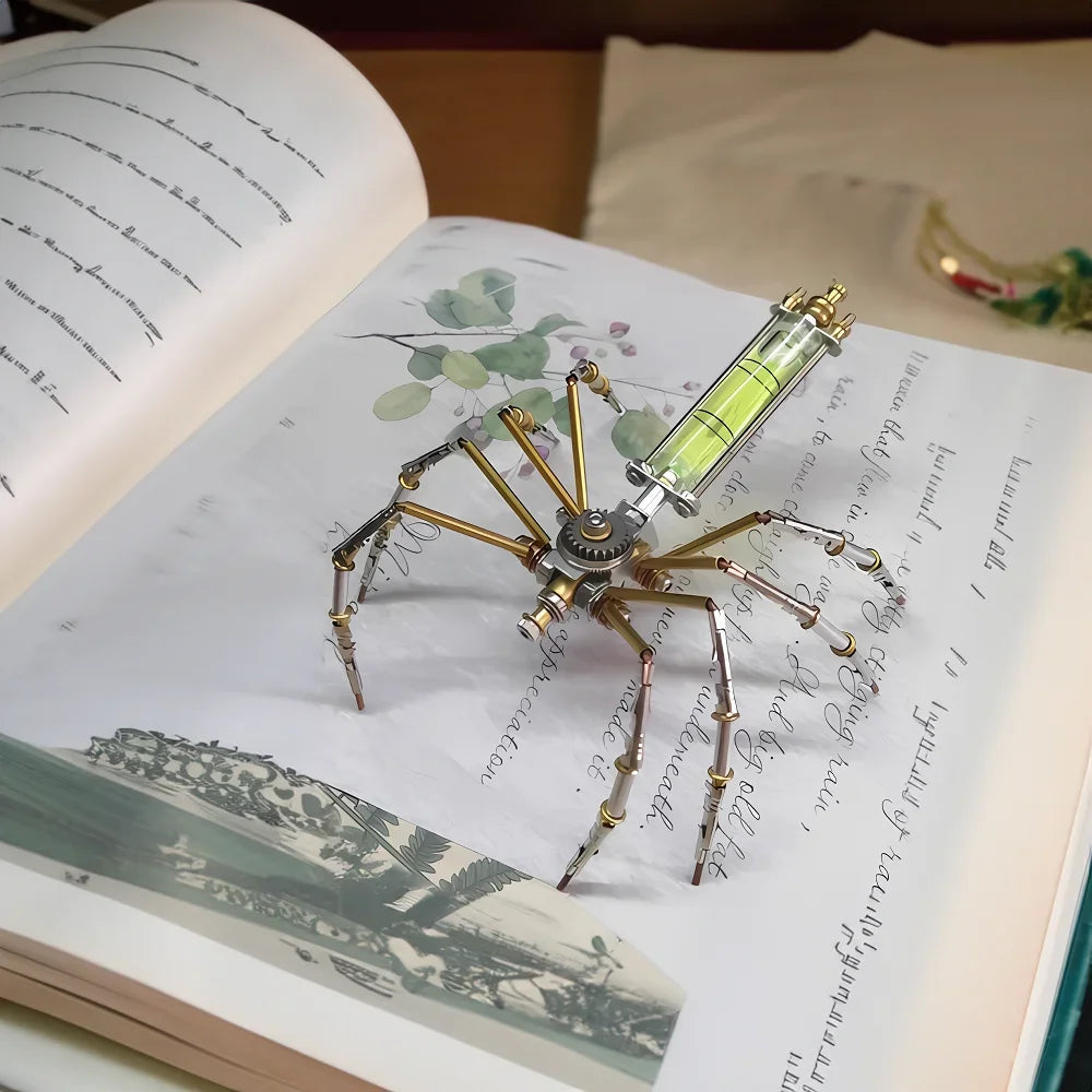 A detailed steampunk metal spider model is displayed on an open book page.