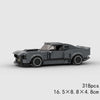 A gray plastic building block set of a classic rally car model.