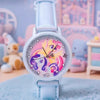 A white wrist watch with a pink and purple floral design on the face, set against a soft blue background.