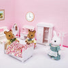 A white miniature dollhouse set featuring forest animal figures, including a bear and a rabbit, with furniture and a wall clo