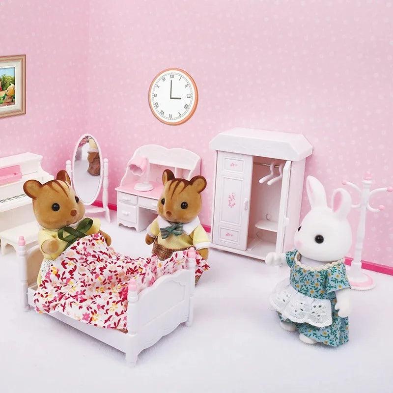 A white miniature dollhouse set featuring forest animal figures, including a bear and a rabbit, with furniture and a wall clo
