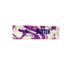 A bar of purple and white marbled salted butter squishy stress relief toy.