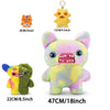 A collection of plush monster toys including a yellow, orange, and green fuggler with various sizes.