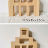 Wooden building blocks shaped like houses in light wood color, showing various sizes.