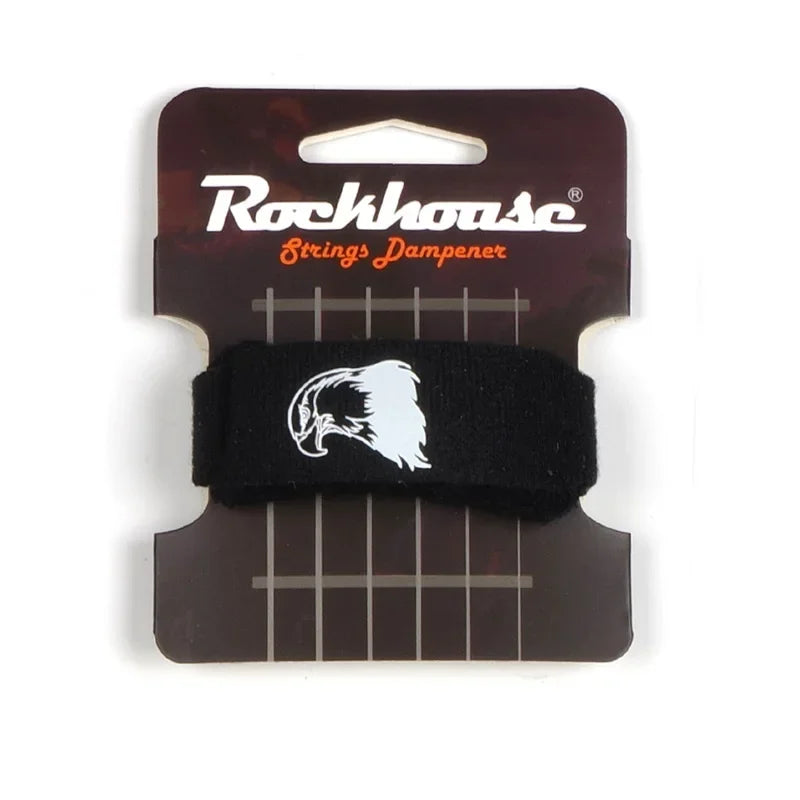 A black guitar string dampener with a white wolf head design and mounting strips.