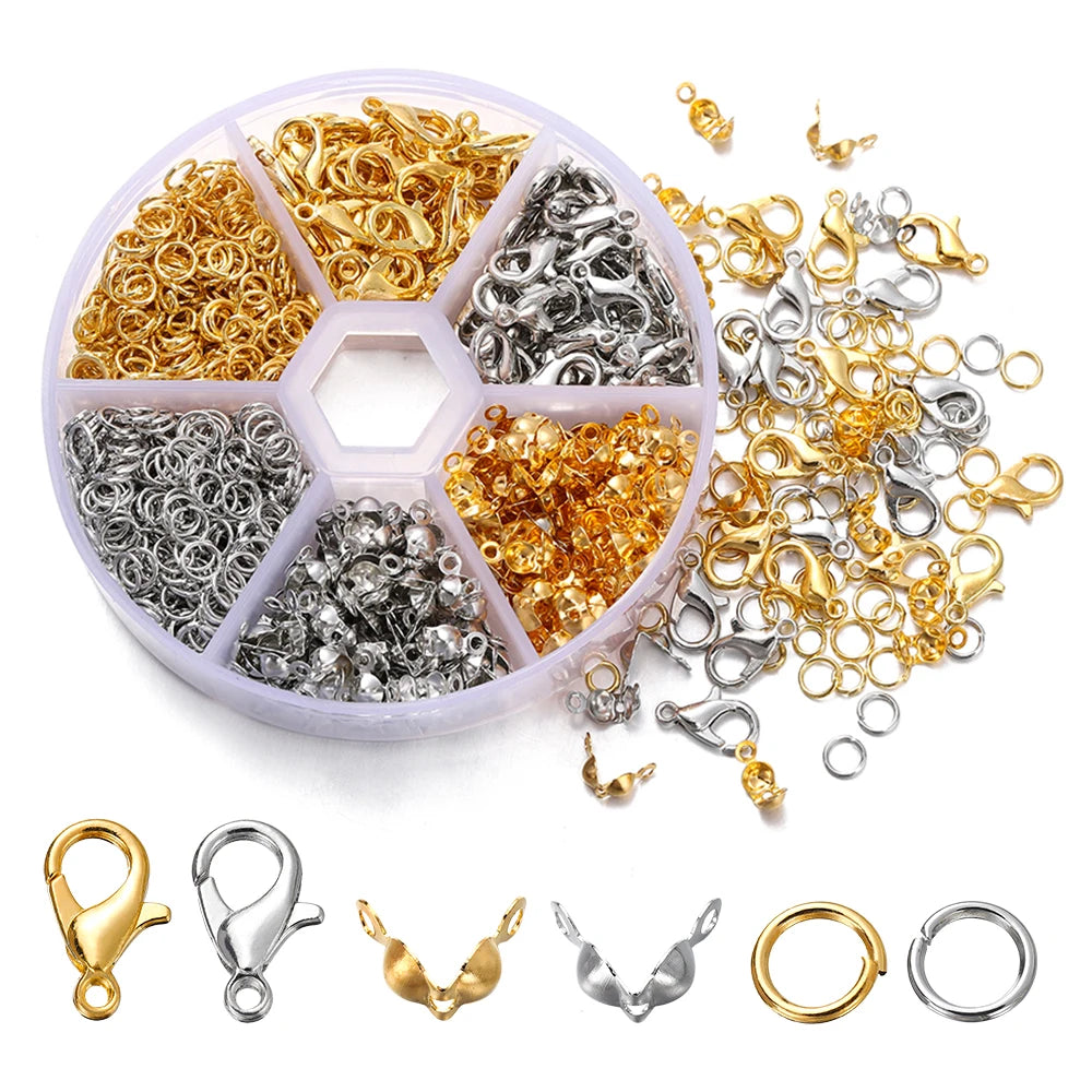 A complete jewelry making kit showing various gold and silver jump rings, clasps, and crimps organized in compartments.