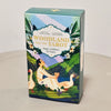 A box for the Woodland Fairy Tale Tarot deck featuring illustrations of a woman and a goose on a green landscape.