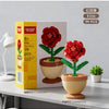 A set of 99 artificial red roses in green pots and a yellow box for home decor
