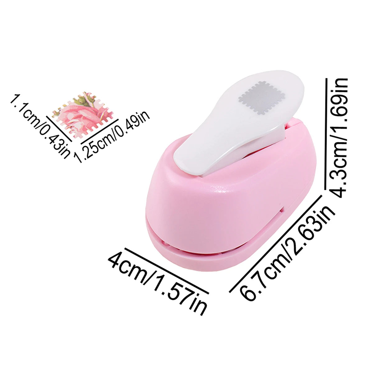 Pink lever action embosser tool with a white embossing plate and measurement markings.