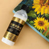 A bottle of NO PT2100 Acrylic Painting Medium 100ml is shown on a light background next to a yellow sunflower print.