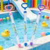 A set of colorful pull-back water guns with pink, blue, and purple handles and clear tubes are shown in a swimming pool.